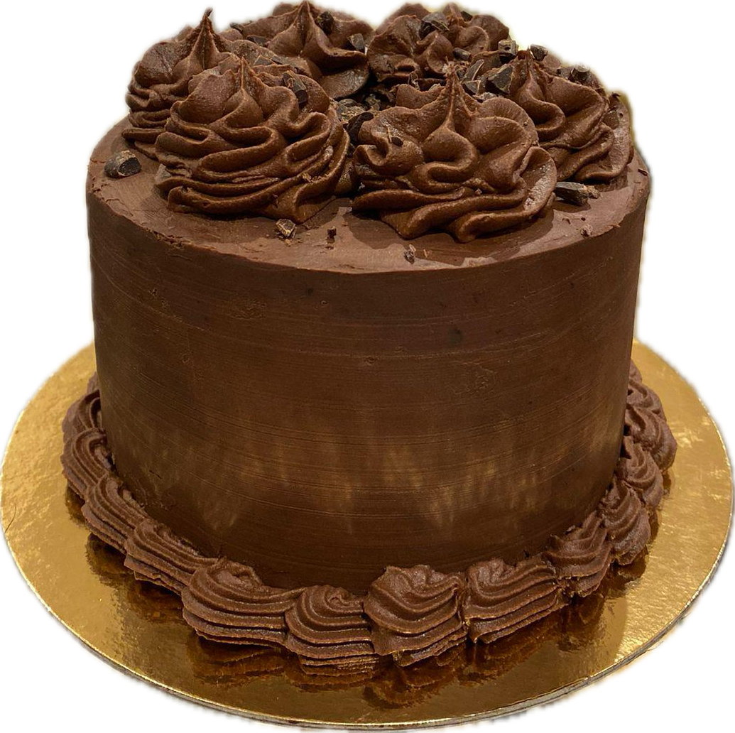 Pastel de chocolate con ganache decorado con virutas de chocolate